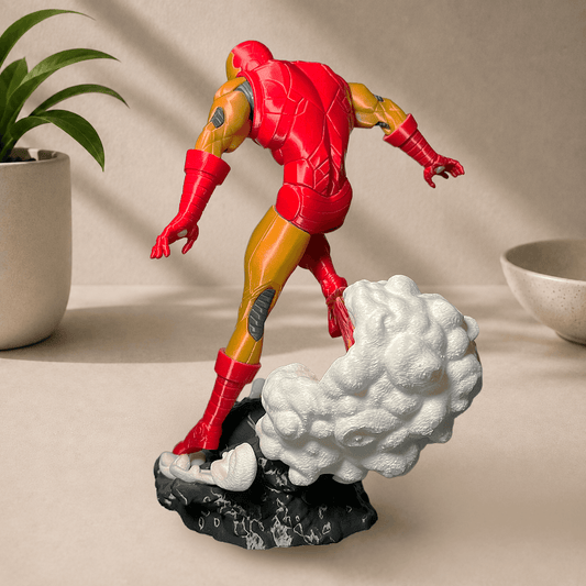 Back view of the 3D-printed classic 1963 comics-style Iron Man figurine, posed leaping off a smoking rock base.