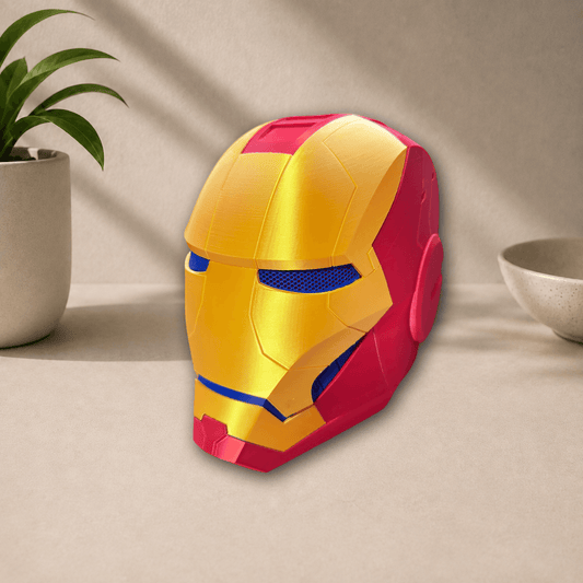 Side profile view of the gold and red 3D-printed Iron Man cosplay helmet, showing its jaw hinge and ear panel detail.