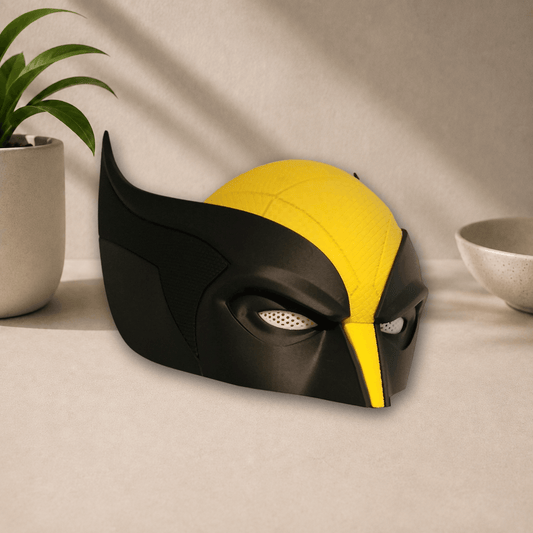 Side profile view of the black and yellow 3D-printed Wolverine cosplay mask, showing its pointed ear fin and eye lens.