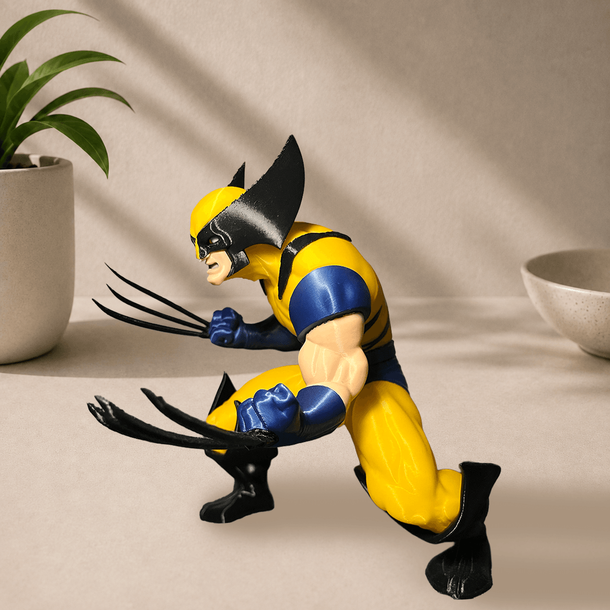 Alternate side view of the 3D-printed Wolverine figure crouched with claws extended.