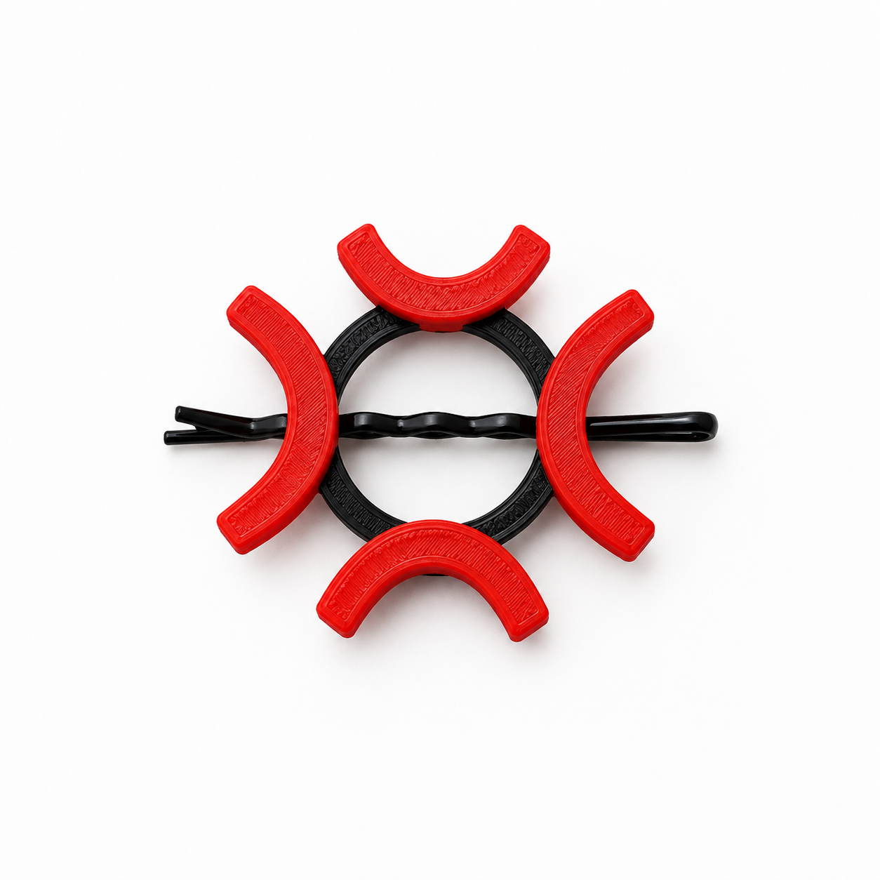 A black twisted bobby pin hair clip decorated with six red crescent-shaped plastic covers, arranged in a circular pattern on a solid white background.