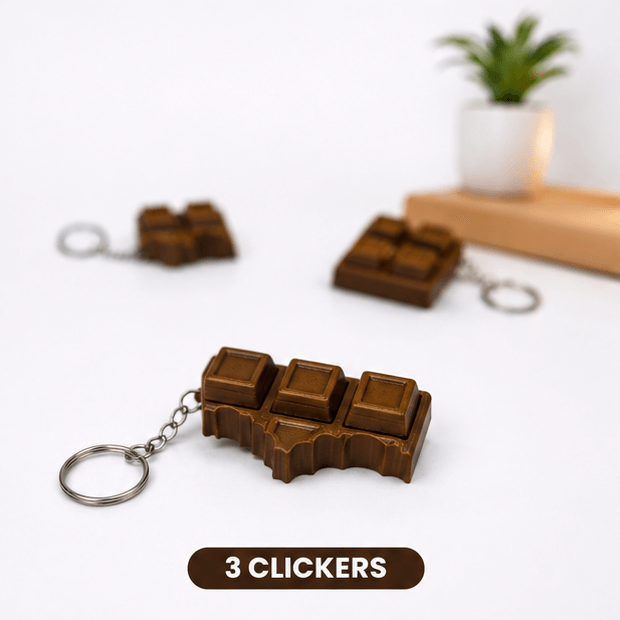 Brown chocolate-bar-shaped fidget keychain with three raised clicker squares exposed, labeled '3 Clickers'.