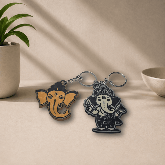 Two 3D-printed Ganesha keychain designs shown together