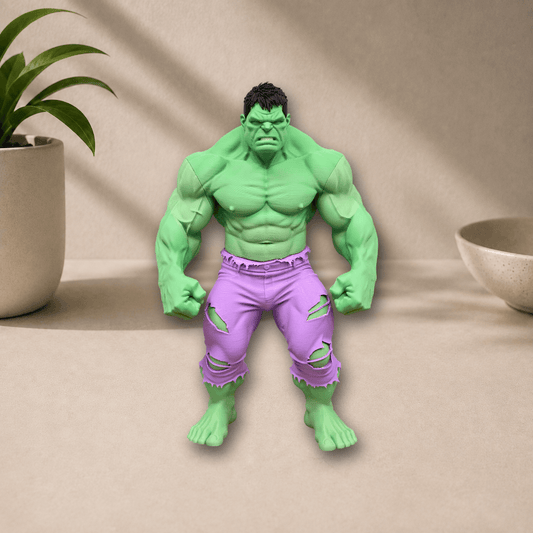 3D-printed Hulk collectible statue in a clenched-fist pose, wearing torn purple pants, displayed on a beige surface with a potted plant nearby.