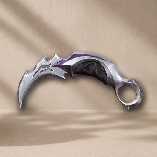 3D-printed Reaver Karambit display prop, front angle, silver blade with purple accent and black grip