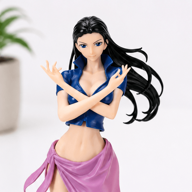 Close-up front view of a Nico Robin One Piece statue with long black hair, a blue crop top, and a pink wrap skirt, arms crossed at the chest.