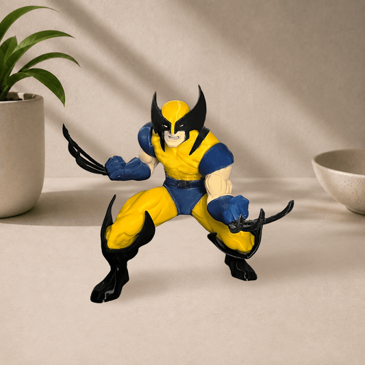 3D-printed Wolverine figure in a yellow and blue suit, crouched in a fighting stance with claws extended.